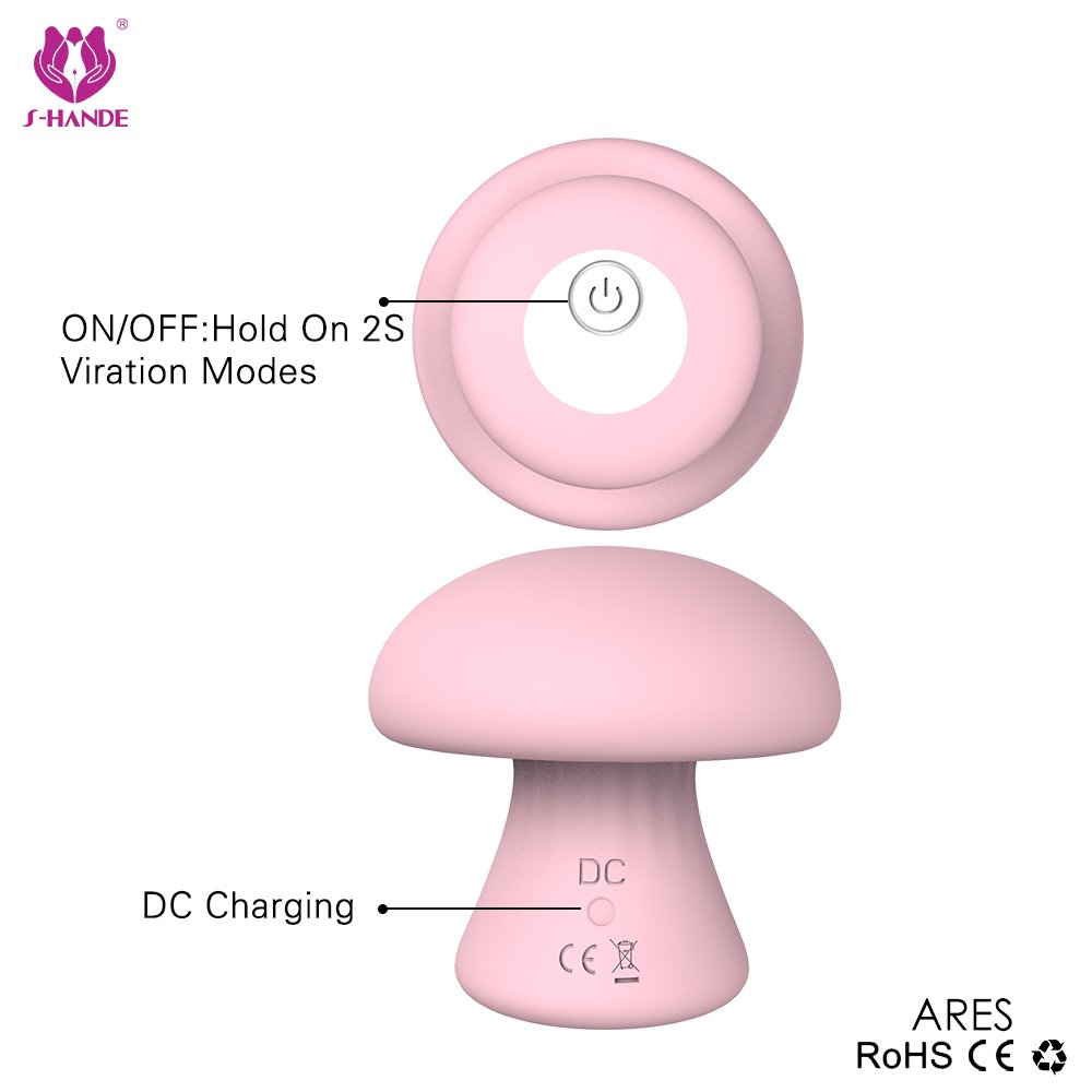 MUSHROOM compact massager in green, ergonomic mushroom shape on white background