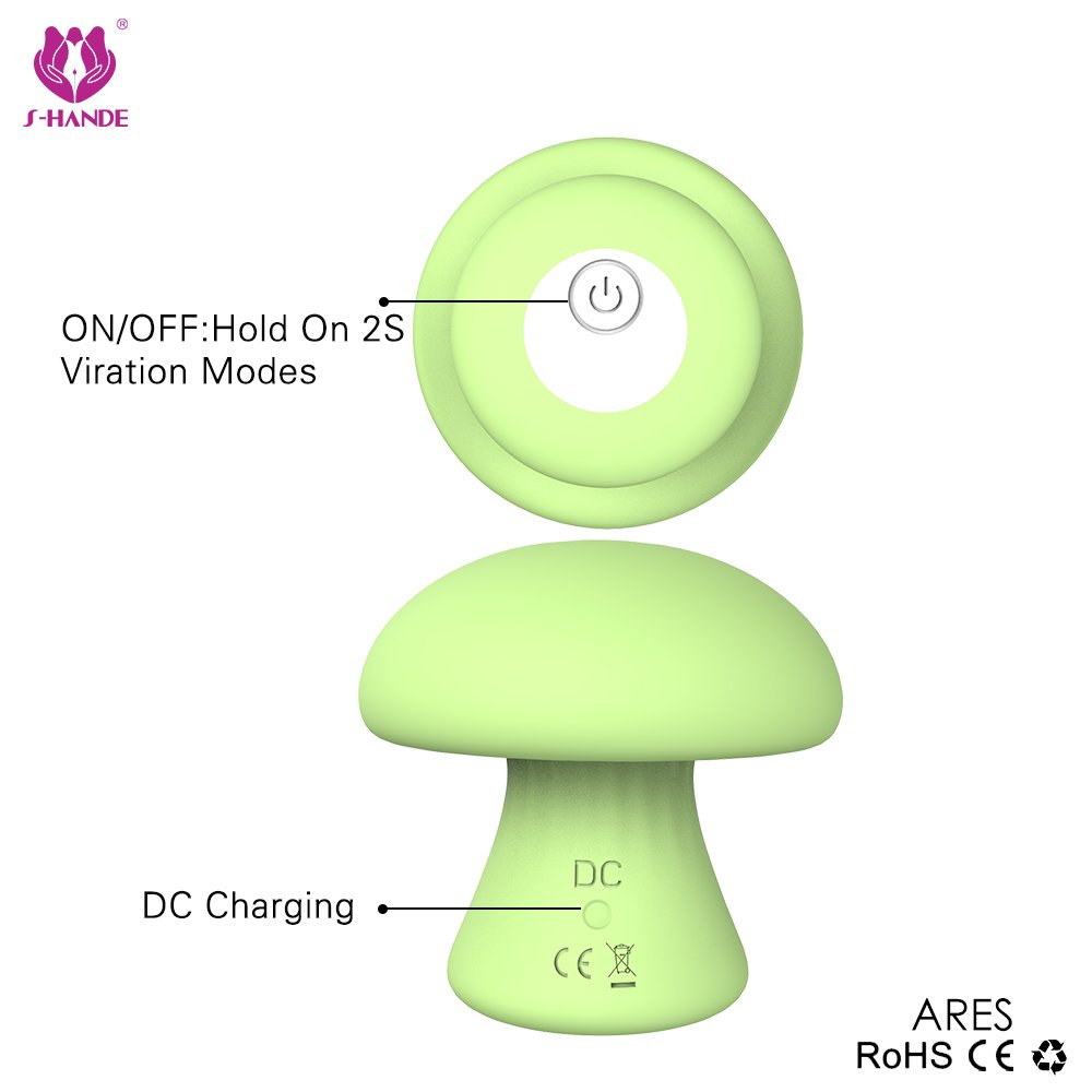 MUSHROOM compact massager in green, ergonomic mushroom shape on white background